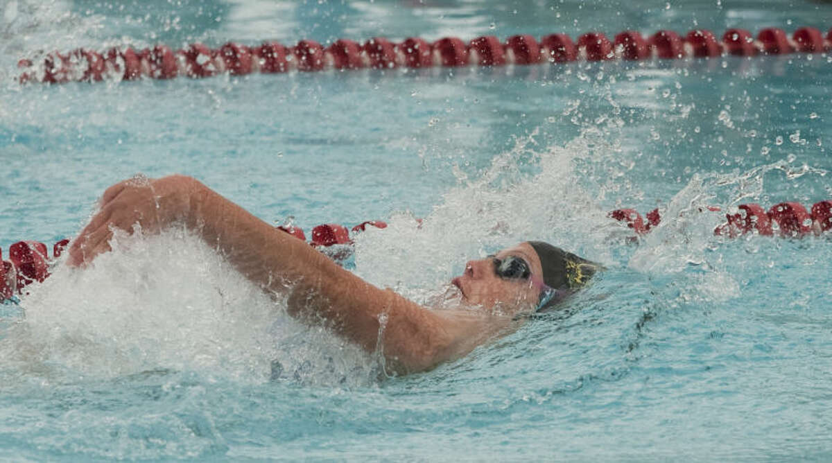 COM's Lindsay Helferich swims Friday in the girls 13 and over 100 m backstroke at the Western National Bank Invitational at Doug Russell Pool. Tim Fischer\Reporter-Telegram