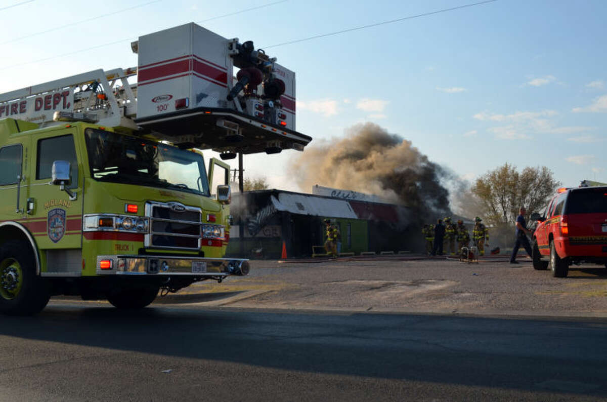 Midland firefighters respond to a structure fire at Club 25 on the 200 block of South Lee Street Friday evening.