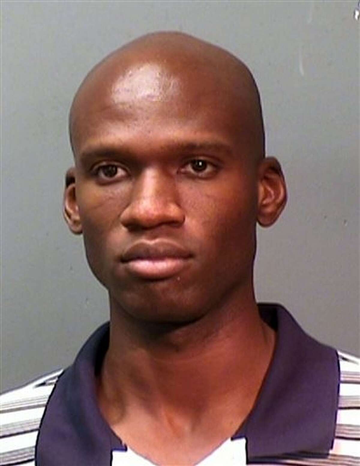 This booking photo provided by the Fort Worth Police Department shows Aaron Alexis, arrested in September, 2010, on suspicion of discharging a firearm in the city limits. The FBI has identified Alexis, 34, as the gunman in the Monday, Sept. 16, 2013 shooting rampage at at the Washington Navy Yard in Washington that left thirteen dead, including himself. (AP Photo/ Fort Worth Police Department)