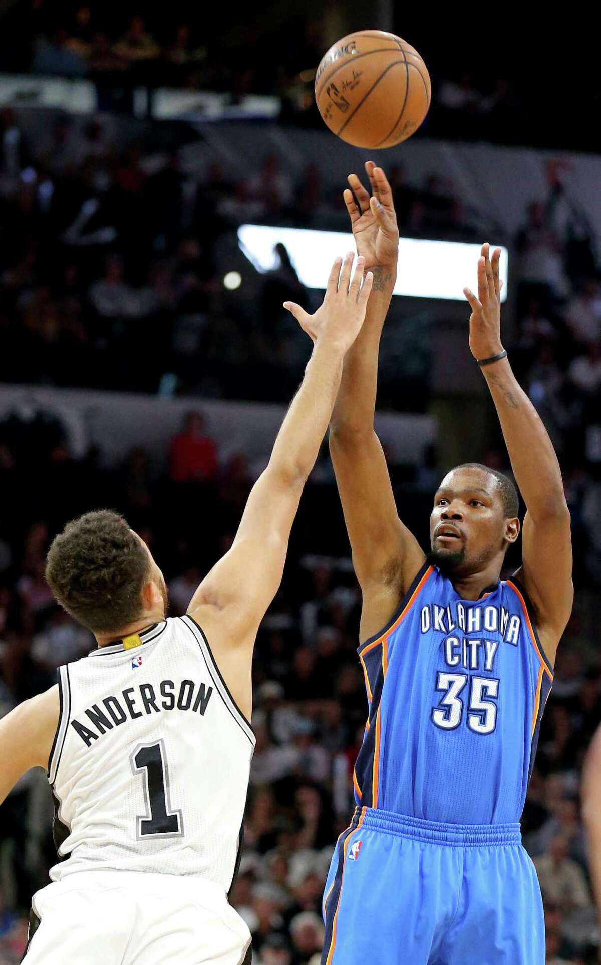 Oklahoma City Thunder's Kevin Durant shoots over San Antonio Spurs' Kyle Anderson during first half action of Game 5 in the Western Conference semifinals Tuesday May 10, 2016 at the AT&T Center.