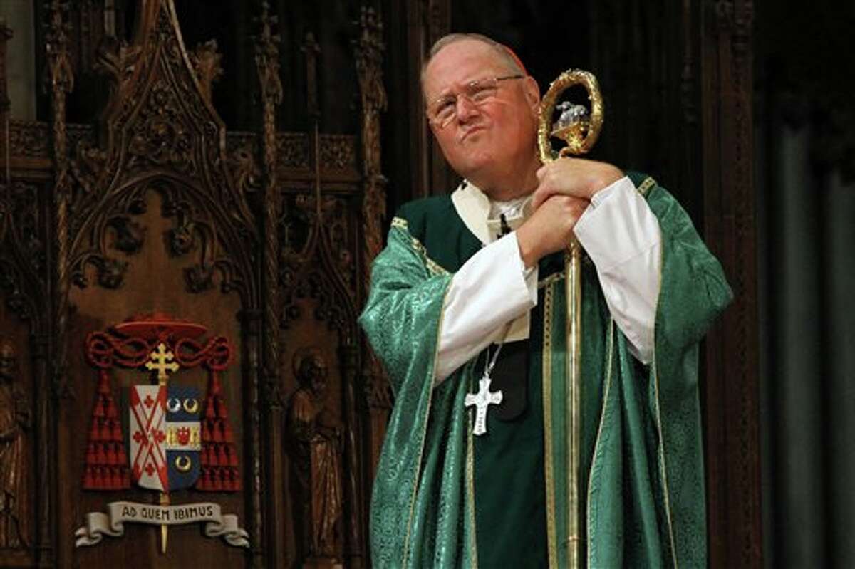 Cardinal Timothy Dolan, listens during Mass, Sunday, Sept. 22, 2013, at St. Patrick's Cathedral in New York. Pope Francis' said Sept. 19, that pastors should focus less on divisive social issues and should emphasize compassion over condemnation. Dolan told reporters that Francis, "speaks like Jesus" and is a "breath of fresh air." (AP Photo/Tina Fineberg)