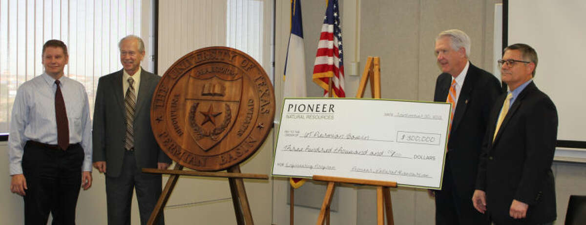 Representatives from UT Permian Basin and Pioneer Natural Resources pose for a photo Monday morning following Pioneer's $300,000 gift to UTPB's engineering program. From left, UTPB Engineering Professor Forrest Flocker, Interim Dean of UTPB's School of Business and Engineering William Price, UTPB President David Watts and Mack Duckworth, Pioneer Natural Resources' engineering training and development senior manager. Meredith Moriak/Reporter-Telegram
