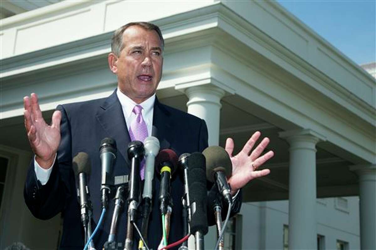 FILE - In this Sept. 3, 2013, file photo House Speaker John Boehner of Ohio speaks to reporters outside the White House in Washington. As lawmakers end their five-week recess, no member of Congress is in a tighter spot than Boehner, who risks seeing most of his Republican colleagues vote against him on three major issues, Syria, the debt limit, and immigration reform. More than a third of House Republicans have urged Boehner to trigger a government shutdown rather than fund the implementation of "Obamacare". (AP Photo/Manuel Balce Ceneta, File)