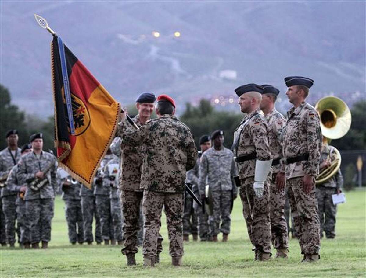 This Sept. 26, 2013 photo shows the deactivation ceremony for the German Air Force's North American command at Fort Bliss, Texas. After nearly 60 years of having a presence in the West Texas desert, the German Air Force has deactivated its USA/Canada Command. The deactivation is the first step toward the Germans closing its command center at Fort Bliss by 2017. The move is part of a German military reorganization. The command dwindled from about 40 officers in previous years to about two dozen, and only seven remained before it was officially shuttered. (AP Photo/The El Paso Times, Vanessa Monsisvais) EL DIARIO OUT; JUAREZ MEXICO OUT
