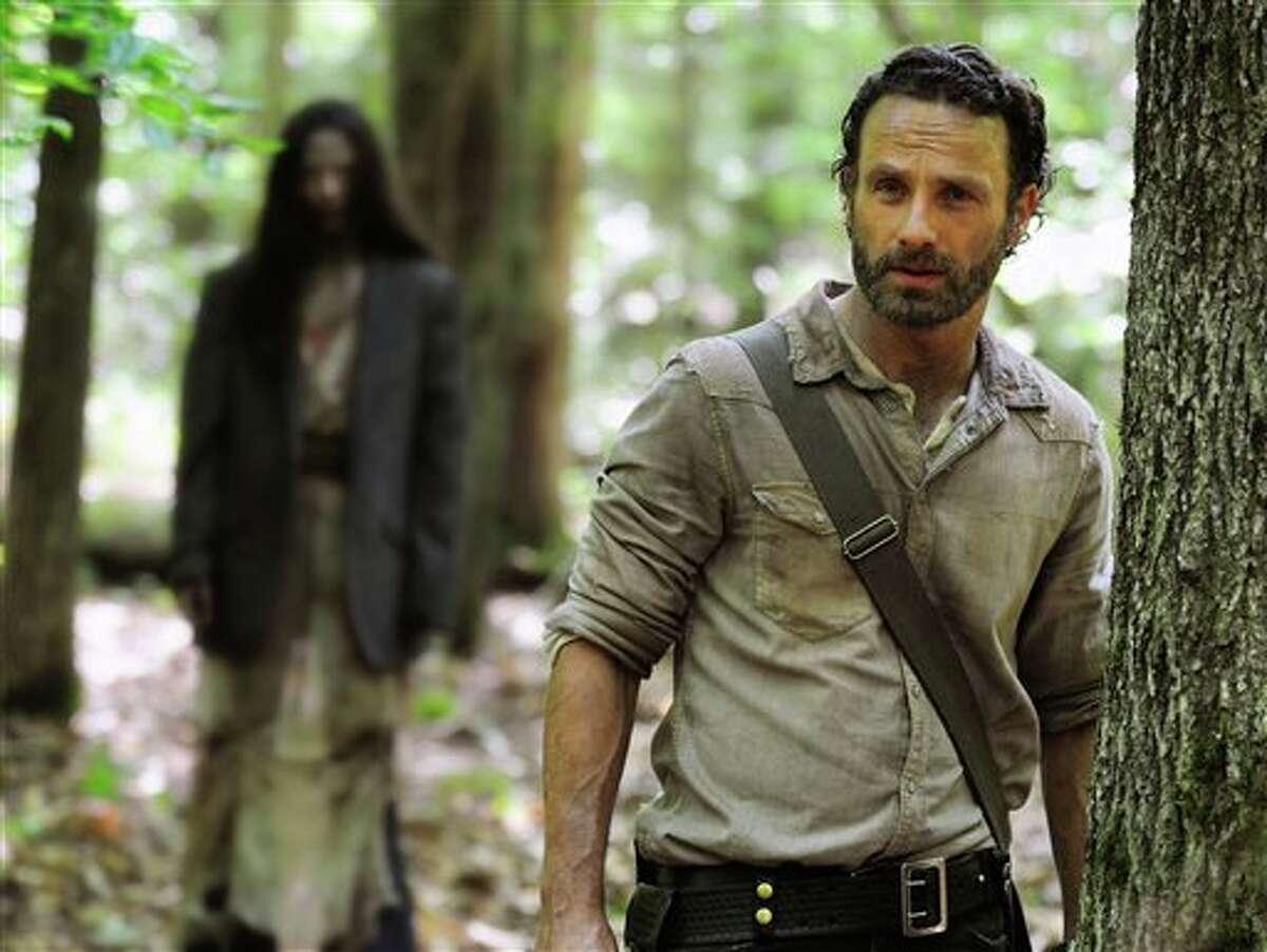 This image released by AMC shows Andrew Lincoln as Rick Grimes in a scene from the season four premiere of "The Walking Dead," airing Oct. 13 at 9 p.m. EST. (AP Photo/AMC, Gene Page)