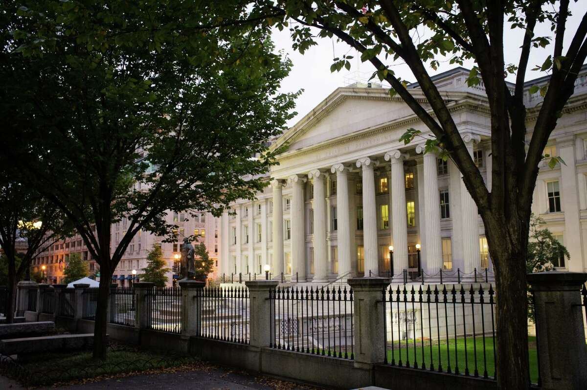 FILE - In this Wednesday, Oct. 16, 2013, file photo, the U.S. Treasury Building stands in Washington. On Friday, April 15, 2016, the Treasury Department reports on foreign holdings of U.S. debt for February. (AP Photo/J. David Ake, File)