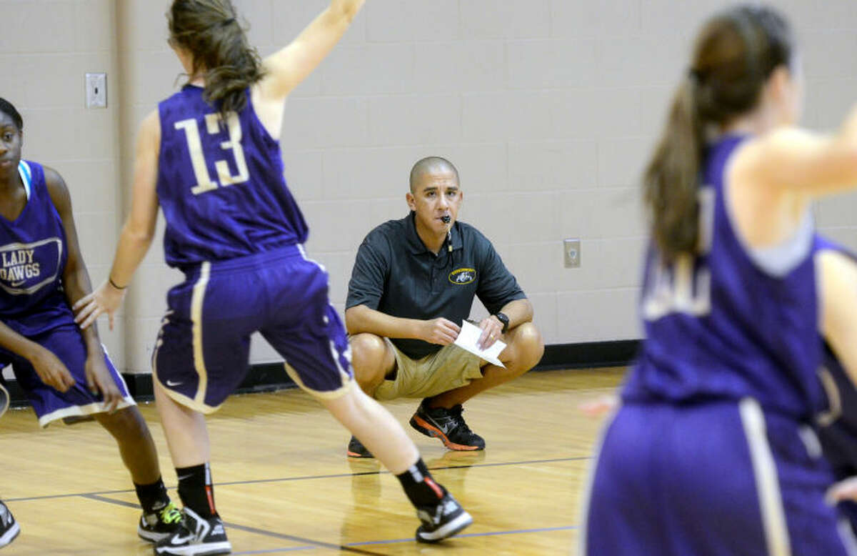 Midland High girls basketball coach Wes Torres works with his team during practice Wednesday at the First Presbyterian Church gym. James Durbin/Reporter-Telegram