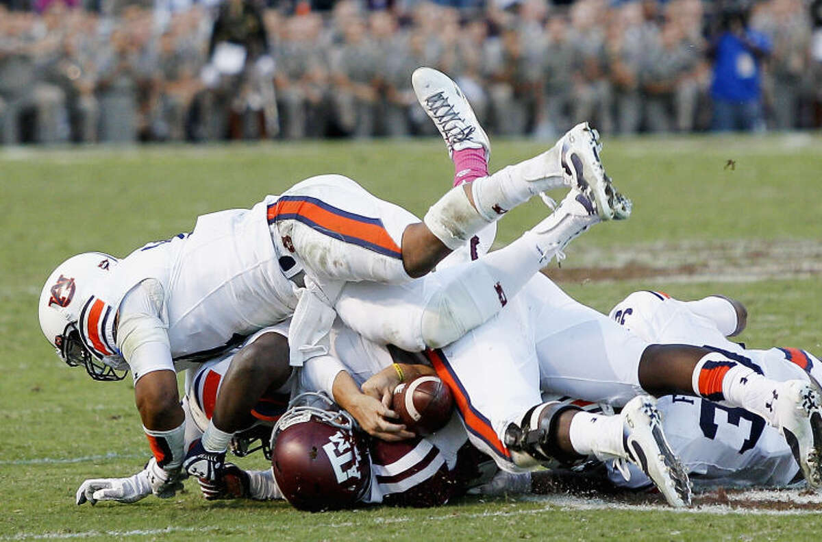 Texas A&M quarterback Johnny Manziel (2) is sacked by Auburn in the fourth quarter of an NCAA college football game Saturday, Oct. 19, 2013, in College Station, Texas. Auburn won 45-41. (AP Photo/Bob Levey)