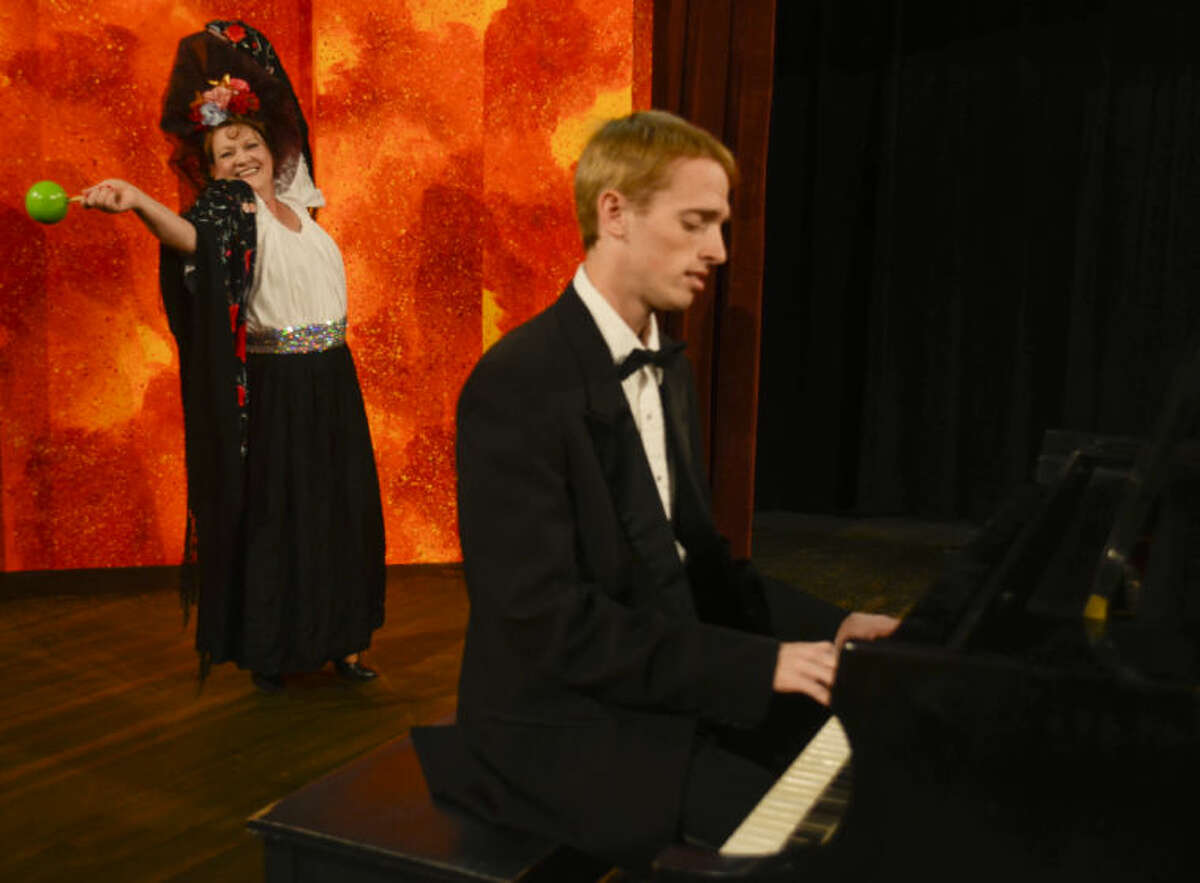 Liz Koeninger as Florence Foster-Jenins dances to her own tune as Jared Griffith as Cosme McMoon plays on the piano in MCT's production of Souvenir. Tim Fischer\Reporter-Telegram