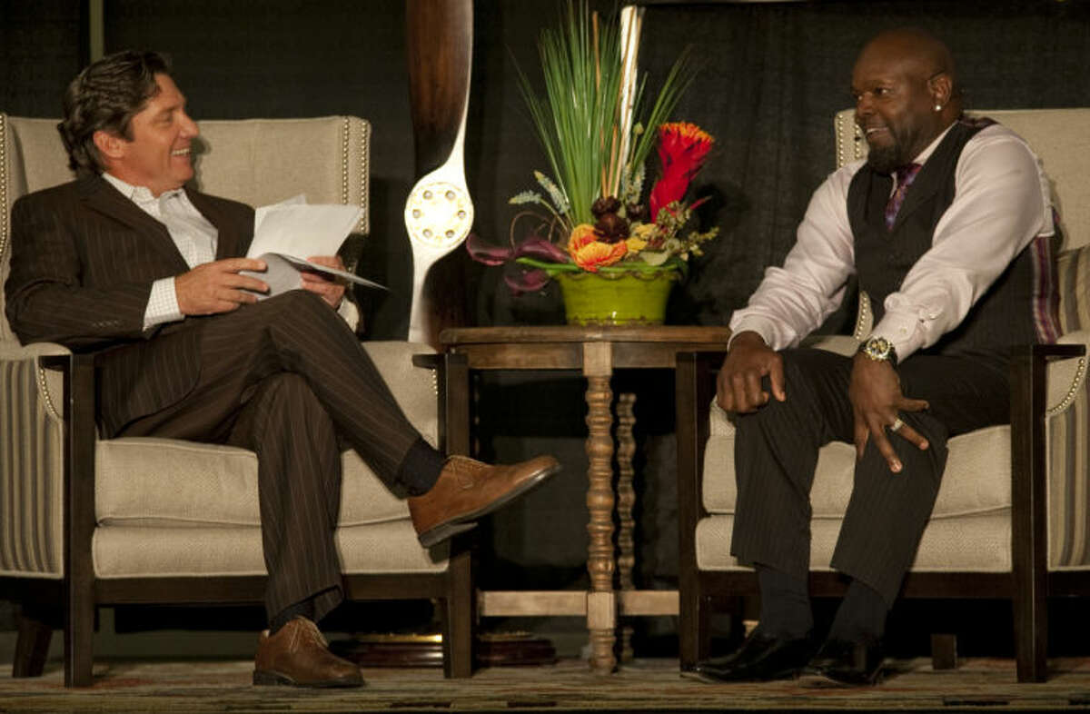 Local TV personality Jay Hendricks talks with former Dallas Cowboy Emmitt Smith Thursday evening during a fundraiser for Opportunity Camp. Tim Fischer\Reporter-Telegram Tim Fischer\Reporter-Telegram