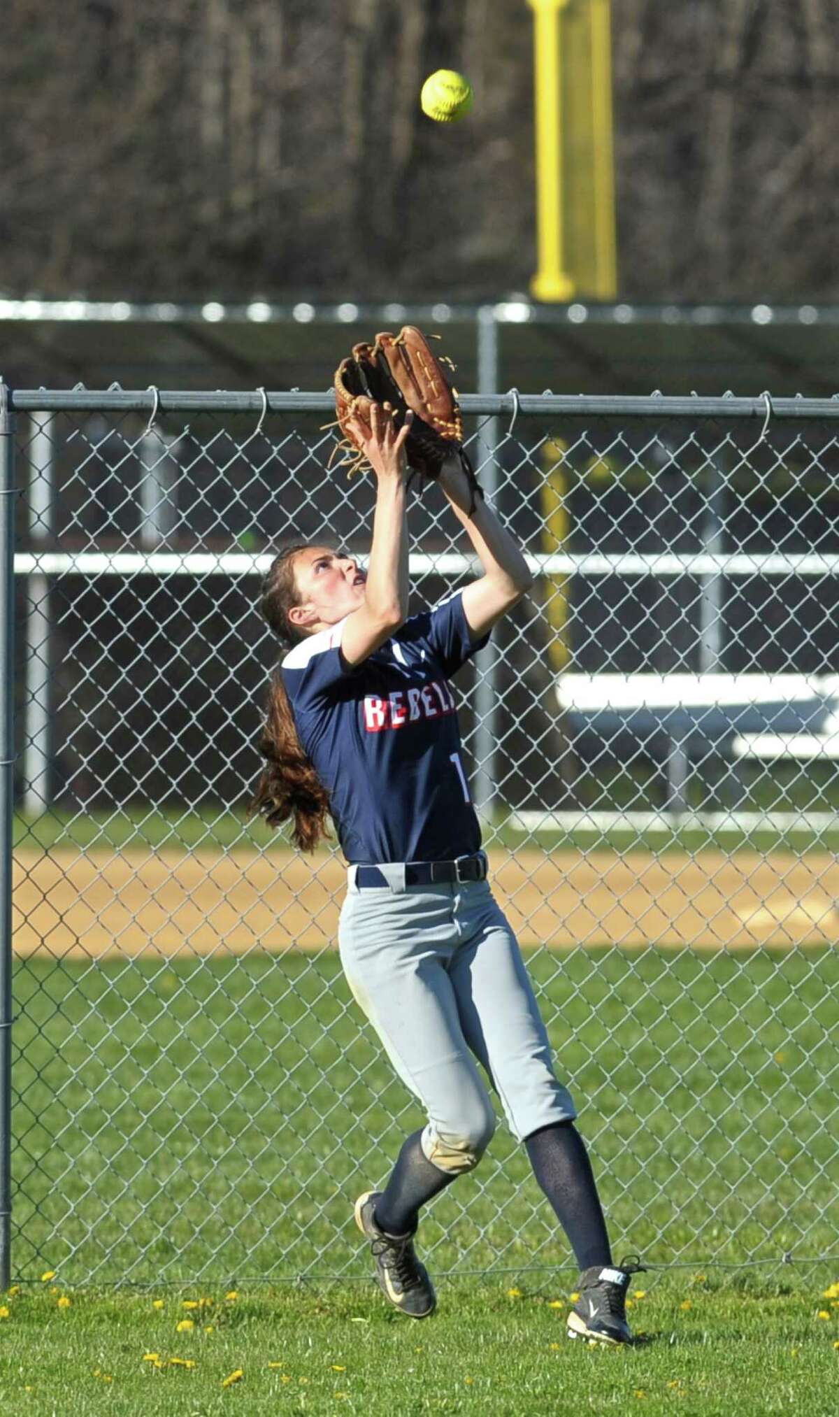New Fairfield's Rachel Mirel (1) makes a catch at the center field fence for the out in the SWC softball game between Masuk and New Fairfield high schools on Wednesday afternoon, April 20, 2016, at New Fairfield High School, New Fairfield, Conn.