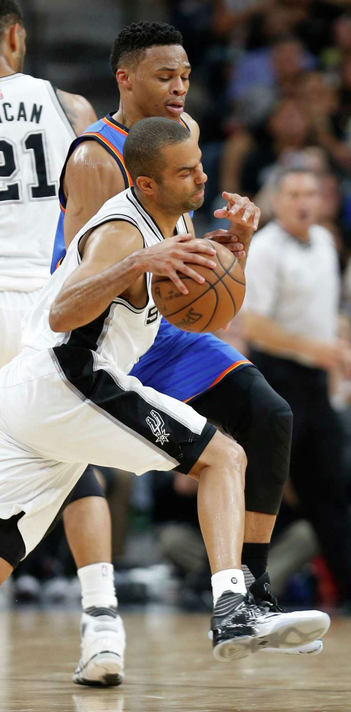 SAN ANTONIO,TX - MAY 10: Tony Parker #9 of the San Antonio Spurs is fouled by Russell Westbrook #0 of the Oklahoma City Thunder in game Five of the Western Conference Semifinals during the 2016 NBA Playoffs at AT&T Center on May 10, 2016 in San Antonio, Texas. NOTE TO USER: User expressly acknowledges and agrees that , by downloading and or using this photograph, User is consenting to the terms and conditions of the Getty Images License Agreement.