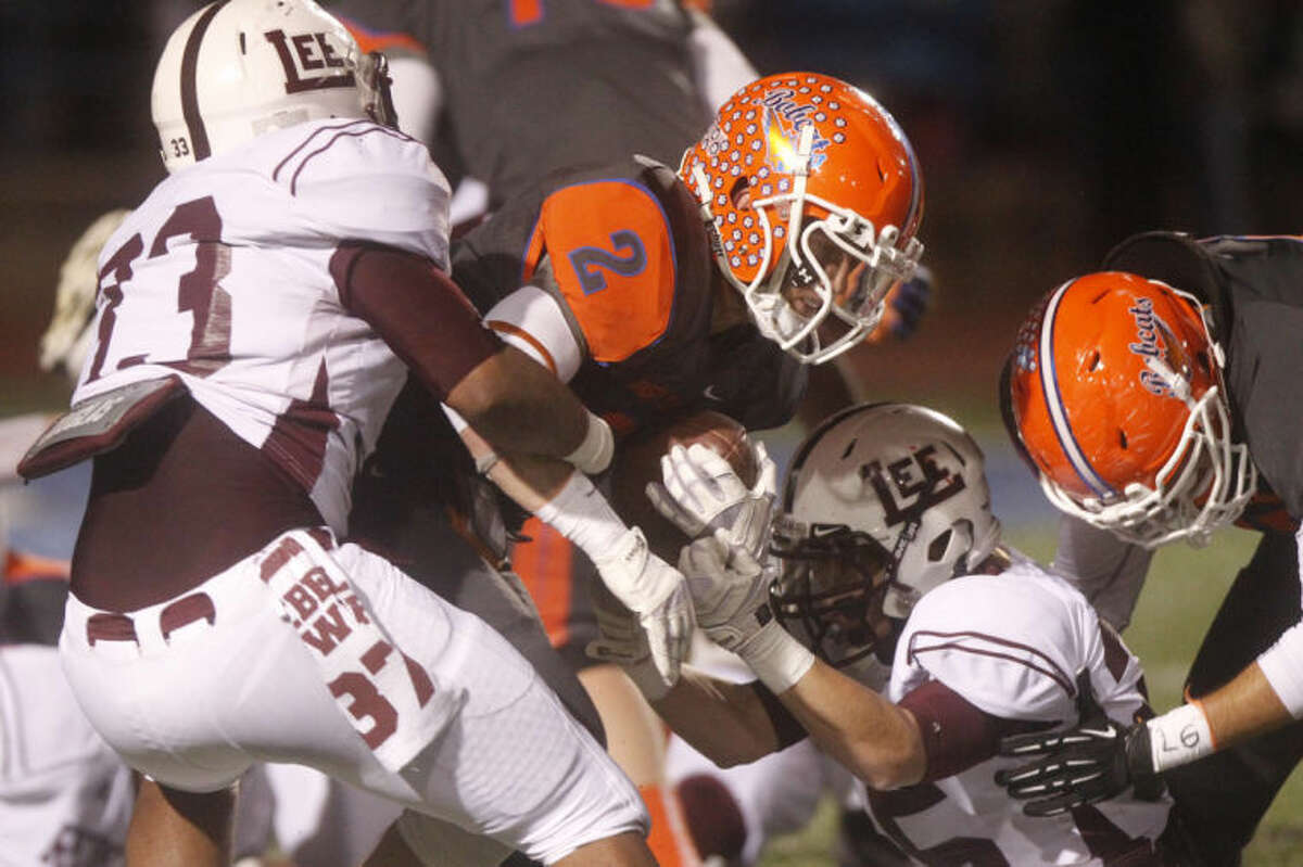 Patrick Dove/Standard-Times Central High School's Braden Hucks (2) moves the ball through the Midland Lee defense Friday night during a District 2-5A game at San Angelo Stadium. shot/archived 11.08.13