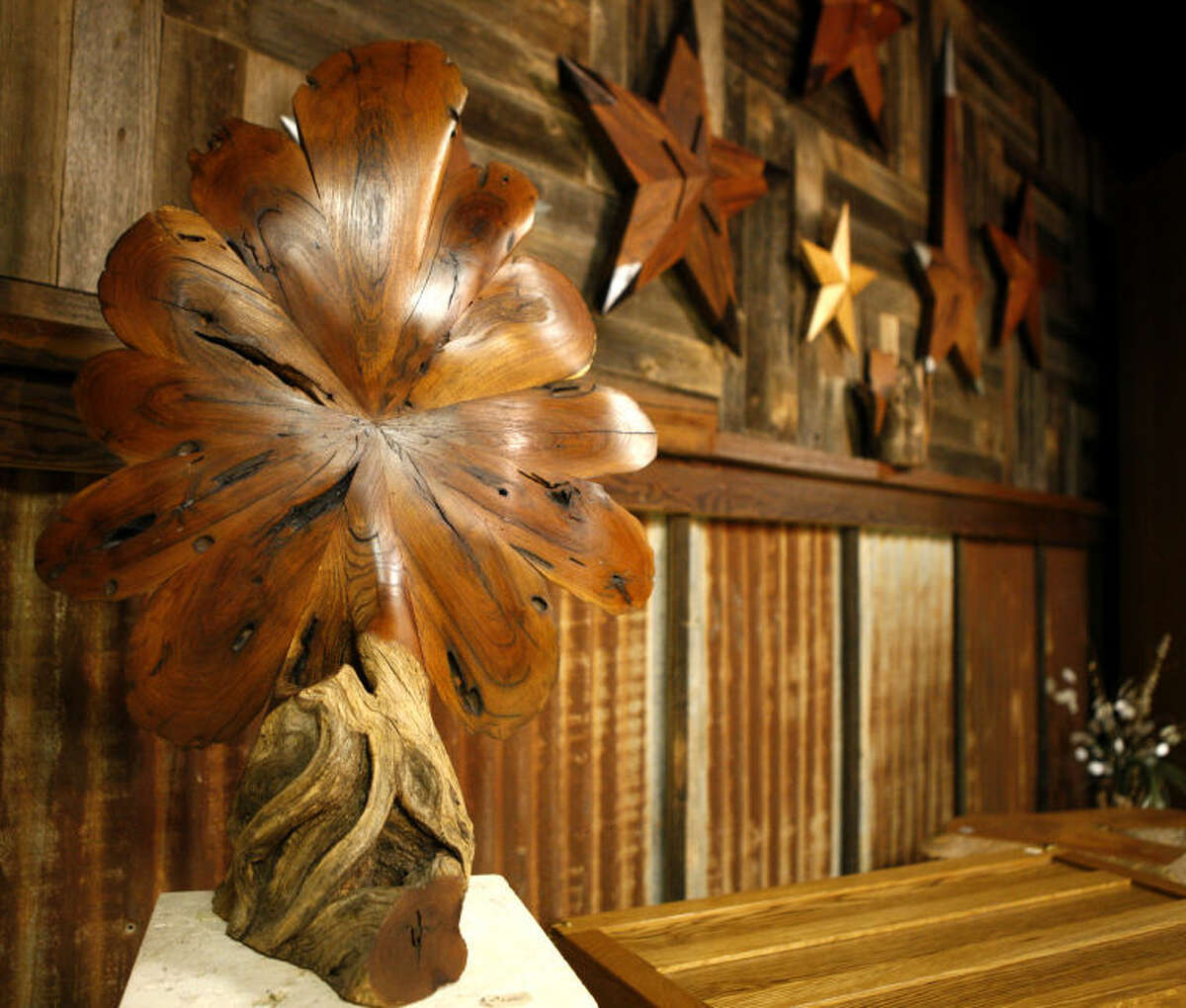 Handcrafted wood art by local artist Steve Culver hang on display during an event featuring art by the artist as well as a Manuscript wine tasting on Saturday. James Durbin/Reporter-Telegram