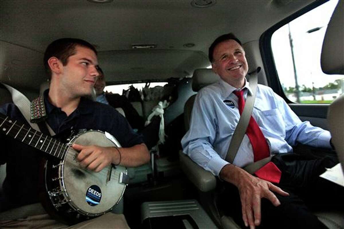 In a Sept. 25, 2009 photo, Democratic gubernatorial candidate Creigh Deeds spends time with his son Gus, left, on the road to Halifax, Va., between campaign events. Virginia State Police confirmed Tuesday, Nov. 19, 2013, that Creigh Deeds was stabbed multiple times and his son Gus, 24, was shot and killed at Deeds' Home in Bath County, Va., during a Tuesday morning assault. (AP Photo/The Virginian-Pilot, Hyunsoo Leo Kim)