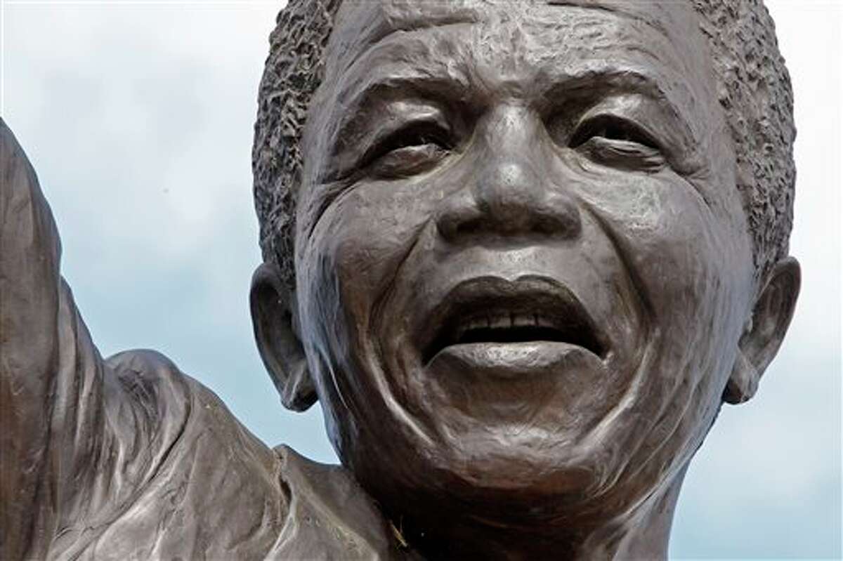 FILE - This Feb. 10, 2010 file photo shows a close up view of the statue of former South African President Nelson Mandela outside the Groot Drakenstein prison near the town of Franschhoek, South Africa, where Mandela was released on Feb. 11, 1990. On Thursday, Dec. 5, 2013, Mandela died at the age of 95. (AP Photo/Schalk van Zuydam, File)