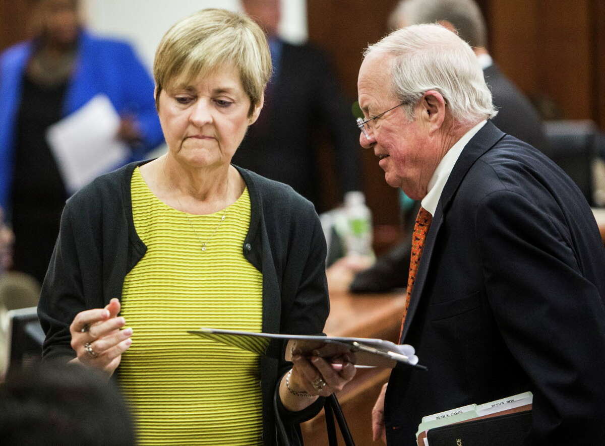 Dr. Carole Busick, Pd.D, stands with attorney Mike Hinton as she appears in court for sentencing on tampering with evidence on Wednesday, May 11, 2016, in Houston. The couple sentenced 10 years deferred adjudication for certifying psych evaluations for potential law enforcement officers, when in fact, the new hires had failed to meet professionally recognized standards.