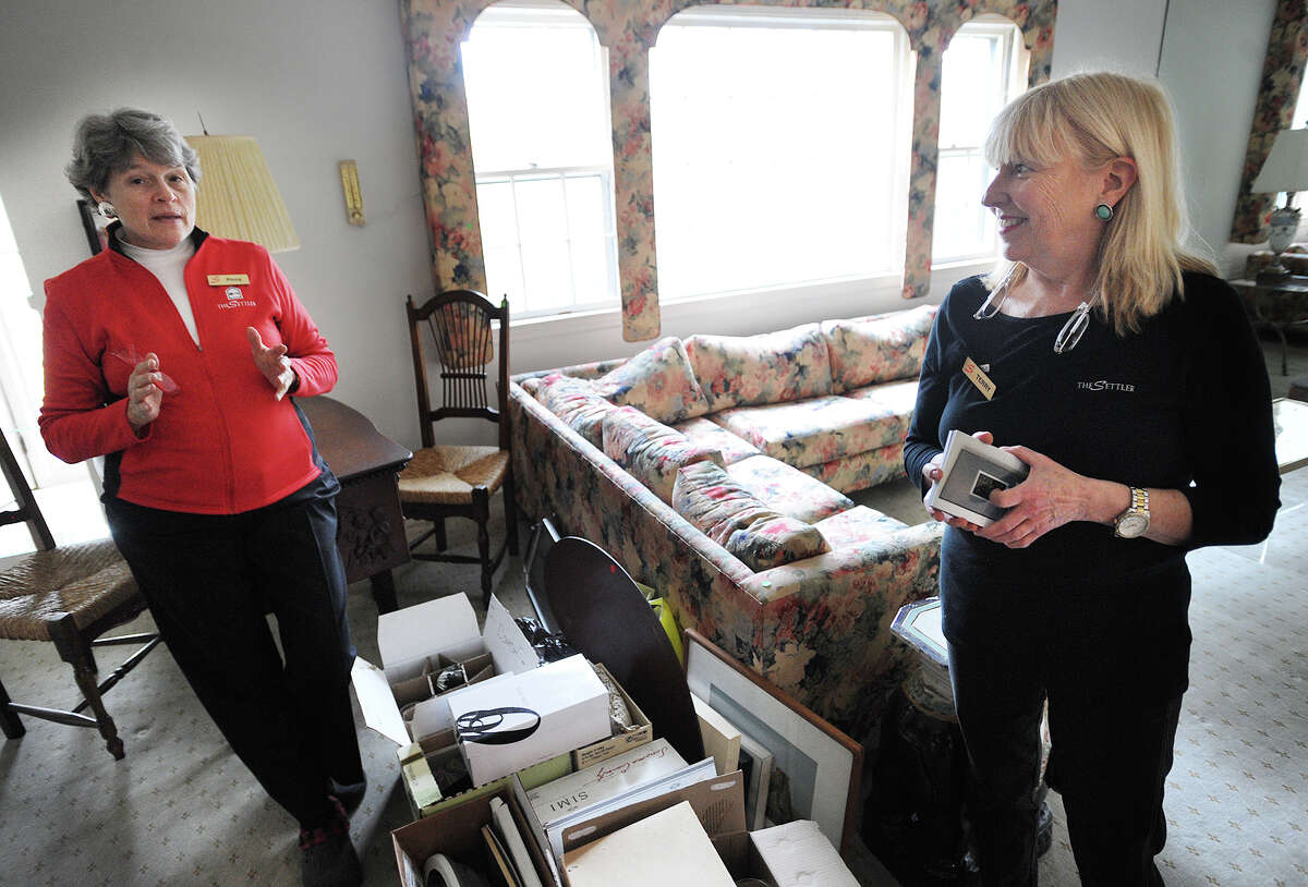 The Settlers owner Pinny Randall, left, and manager Terry VanDerheyden discuss the business in the home of company client Karley Meltzer in Westport, Conn. on Thursday, April 7, 2016.