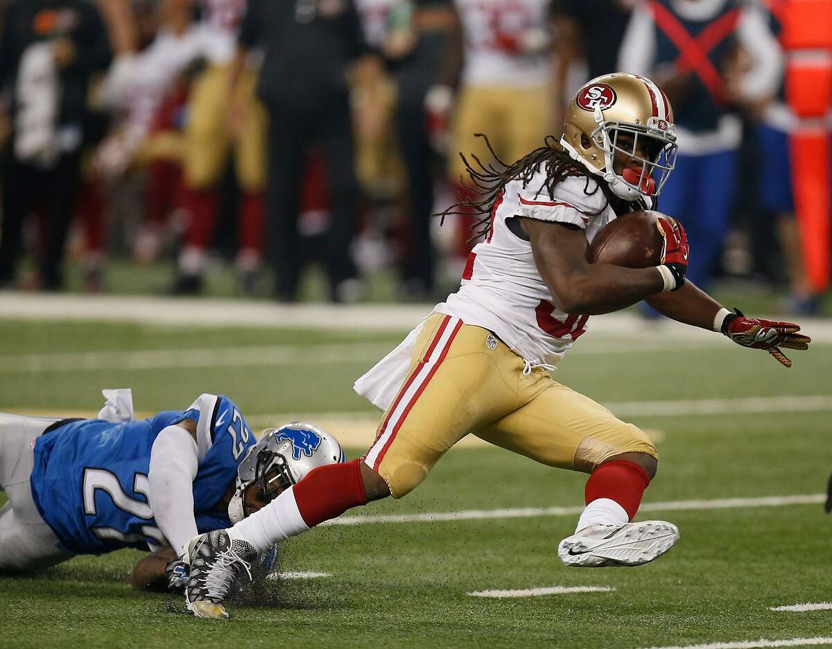DETROIT, MI - DECEMBER 27: DuJuan Harris #32 of the San Francisco 49ers carries the ball during the second quarter while playing the Detroit Lions at Ford Field on December 27, 2015 in Detroit, Michigan. (Photo by Gregory Shamus/Getty Images)