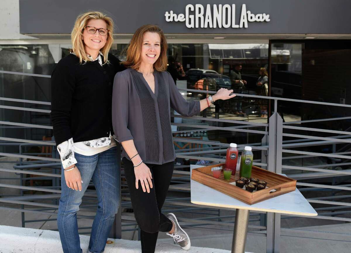 Co-owners Julie Mountain, left, and Dana Noorily pose outside The Granola Bar along Greenwich Avenue in downtown Greenwich, Conn. Monday, May 9, 2016. The new Greenwich location is soon opening in addition to the Westport location that has been open for two years.