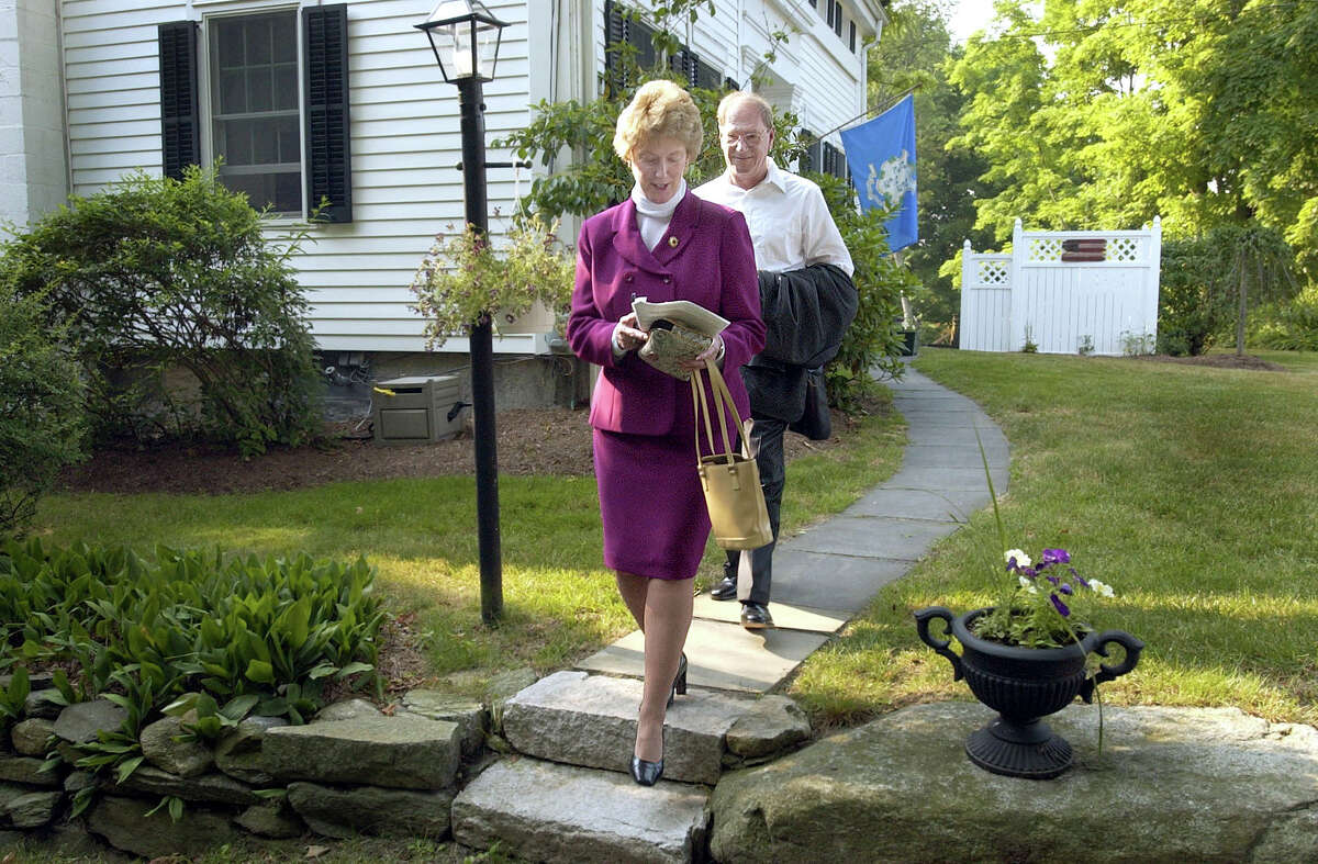 M. Jodi Rell and her husband Lou leave their Brookfield home for Hartford early Thursday morning where she was sworn in as governor of Connecticut. July 2004