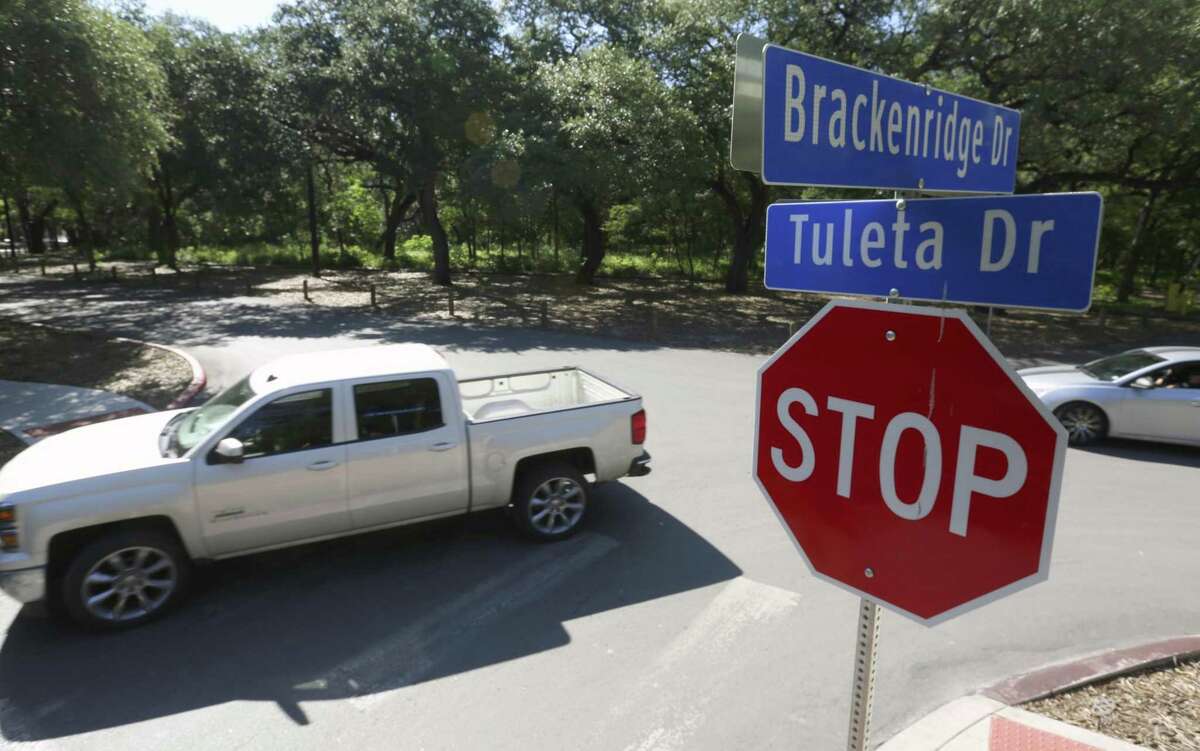 Vehicles drive through the intersection of Brackenridge and Tuleta Drives in the heart of Brackenridge Park. Removing some of the streets and parking spaces and having people leave their cars at a private parking garage on the park's fringes are some of the ideas included in a draft master plan for the park that was unveiled last year. Those proposals were scrapped in the new master plan approved March 2, 2017.
