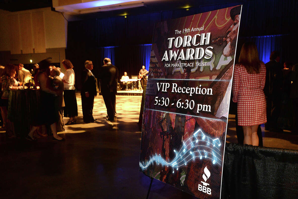 Guests enjoy the VIP reception and cocktail hour at Tuesday night's 19th annual Better Business Bureau Torch Award ceremony for Marketplace Trust, in the for-profit and non-profit categories. A dinner and silent auction kicked off the event at the Civic Center. Guest speaker Beth Misner introduced this year's finalists and award winners. Revenues from the Banquet and Auction benefit the endowed BBB Scholarships at Lamar University College of Business, Lamar Institute of Technology, Lamar State College Orange, and Lamar State College Port Arthur and the BBB Consumer Education Foundation, Inc. Photo taken Tuesday, May 10, 2016 Kim Brent/The Enterprise