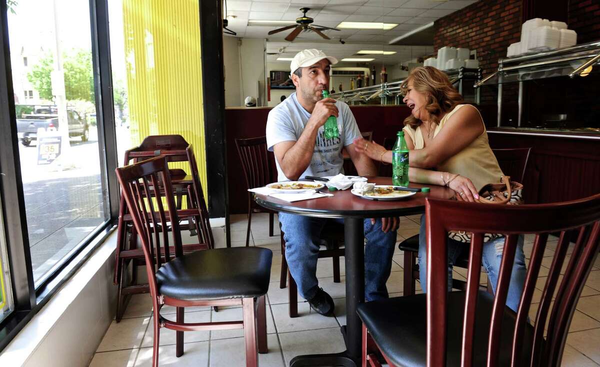 Friends Walter Zagara, of Danbury, and Claudina Duque, of Danbury, enjoy lunch at Banana Brazil, on Main Street in Danbury. According to a survey by the financial website WalletHub, Danbury is the 21st most diverse city in the country, ranked just below San Francisco. Thursday, May 12, 2016, in Danbury, Conn.