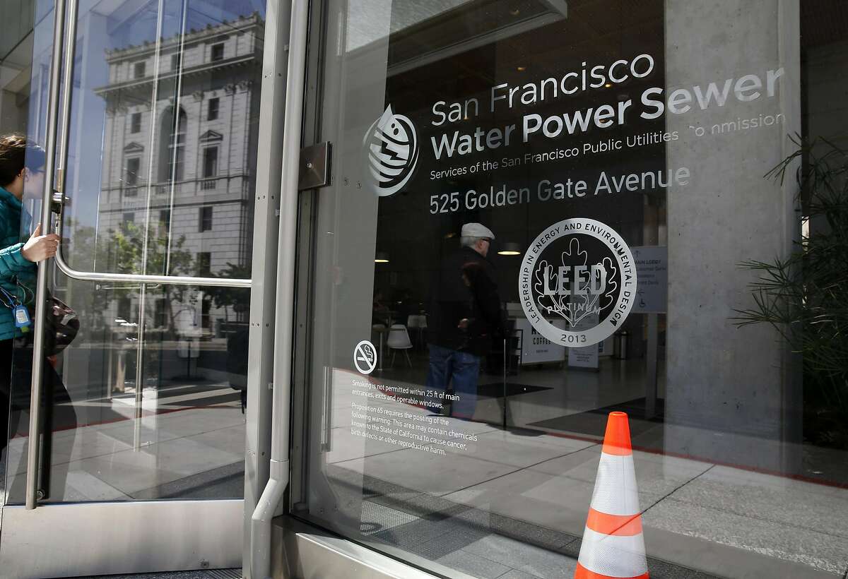 People enter the LEED certified Public Utilities Commission building at 525 Golden Gate Ave in San Francisco, California, on Thursday, May 12, 2016.