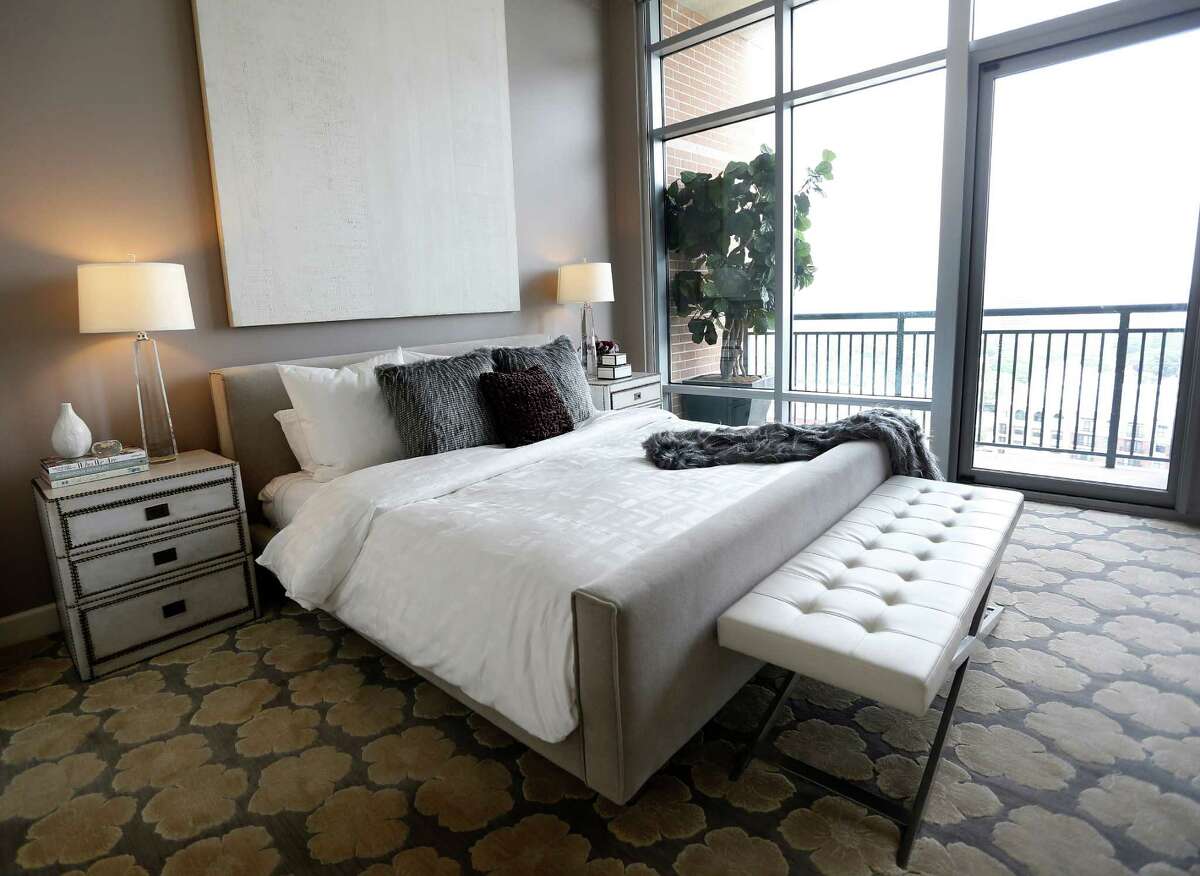 The master bedroom features clean lines with outstanding views out the floor-to-ceiling windows.﻿