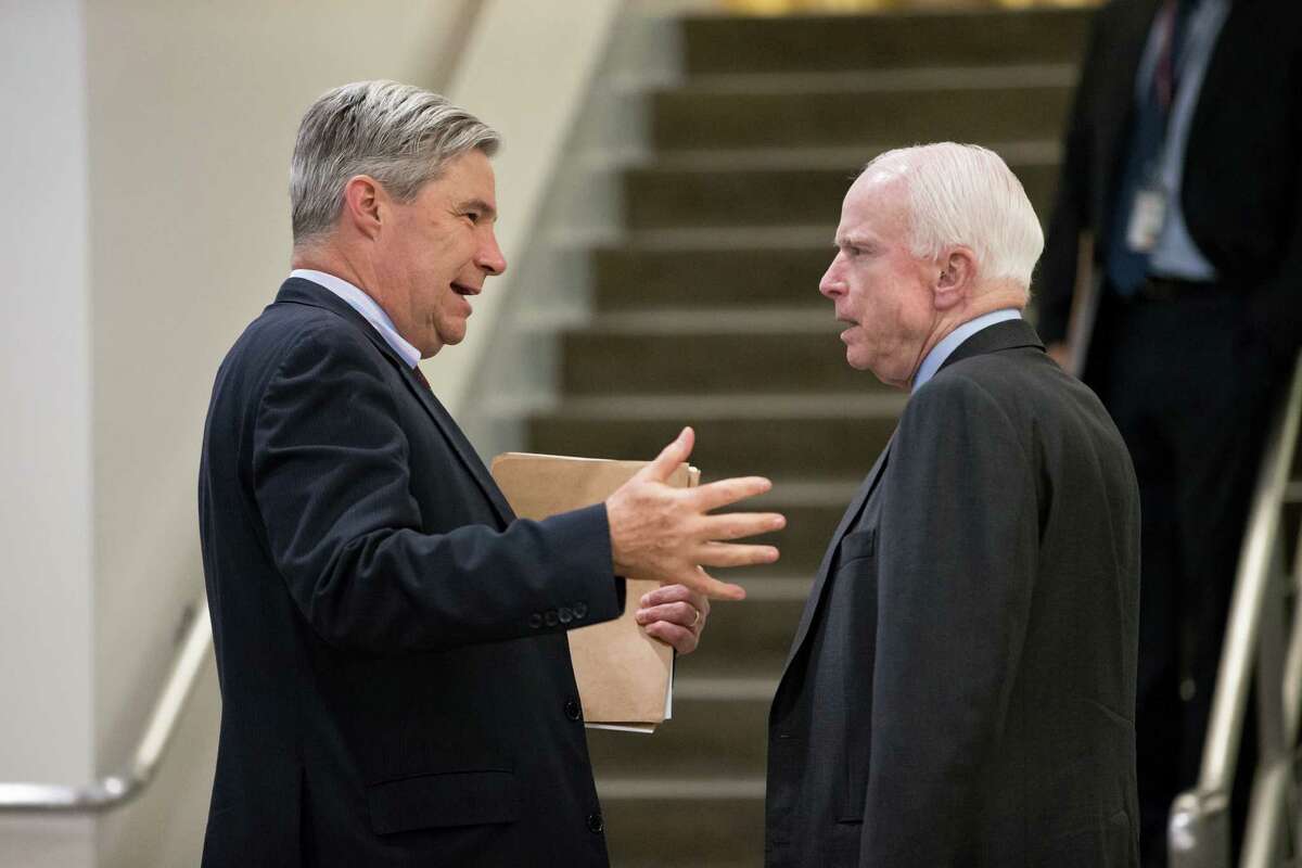 Sen. Sheldon Whitehouse, D-R.I., left, speaks with Senate Armed Services Committee Chairman Sen. John McCain, R-Ariz., on Capitol Hill in Washington, Thursday, May 12, 2016, as the Senate winds up its week The Armed Services panel is moving to complete work on the military's budget, the National Defense Authorization Act. (AP Photo/J. Scott Applewhite) ORG XMIT: DCSA109