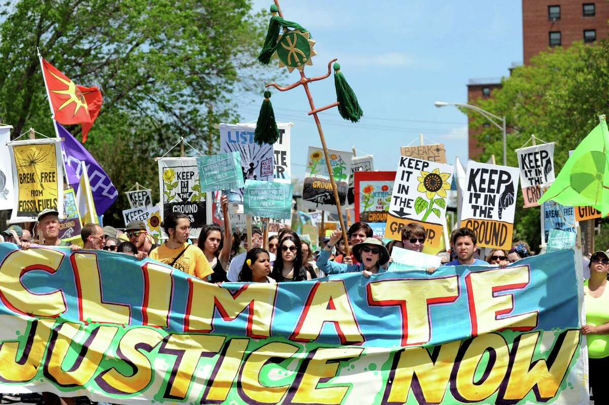 Environmental activists from around the region march down Pearl Street to the Port of Albany on Saturday, May 14, 2016, in Albany, N.Y. The demonstration delayed oil train traffic at the Port of Albany to raise awareness for the region's opposition to all fossil fuels. The event was part of a weeklong global effort called Break Free From Fossil Fuels. (Cindy Schultz / Times Union)