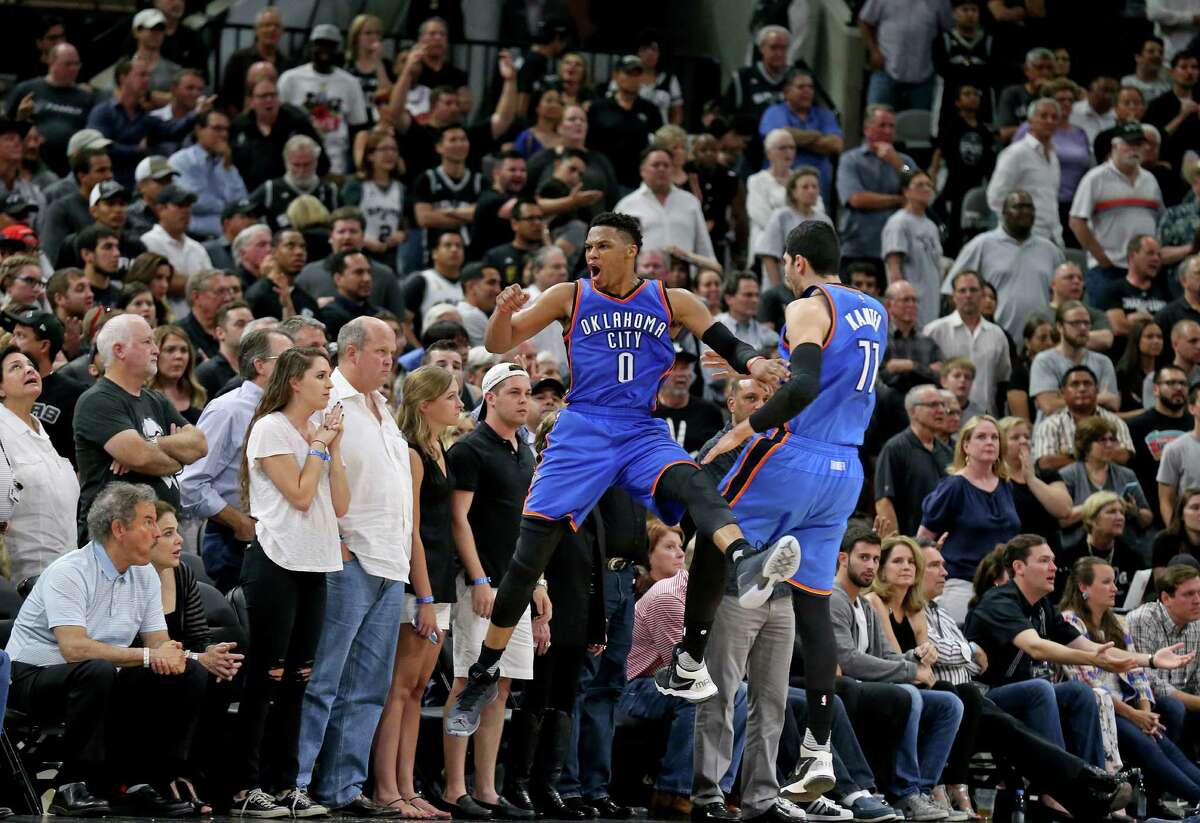 Oklahoma City Thunder's Russell Westbrook celebrates with teammate Enes Kanter after a basket late in second half action of Game 5 in the Western Conference semifinals against the San Antonio Spurs Tuesday May 10, 2016 at the AT&T Center. The Thunder won 95-91.