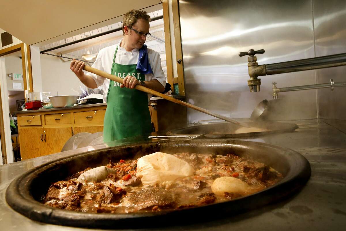 Manuel Azevedo, prepares the Beef Sopas in three huge cast iron pots on Sat. May 14, 2016, for the annual Festa celebration at the Sausalito Portuguese Cultural Center in Sausalito, California, on Sat. May 14, 2016.