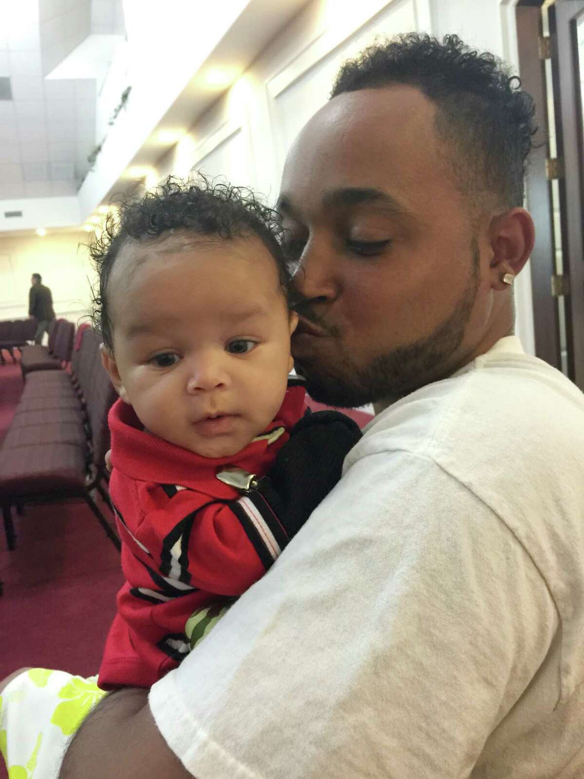 ﻿Rodrin Hinton, holding his son, Rodrin﻿ Jr., died in March in ﻿the Harris County Jail. ﻿