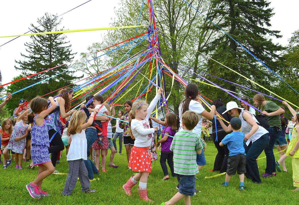 A maypole dance was part of the celebration of spring at Wakeman Town Farm, one of many activities planned around town Saturday for GreenDay.