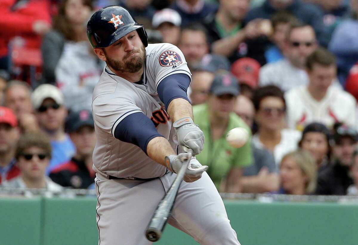 Houston Astros' Tyler White hits an RBI single off a pitch by Boston Red Sox's Robbie Ross Jr. in the sixth inning of a baseball game at Fenway Park, Sunday, May 15, 2016, in Boston. (AP Photo/Steven Senne)