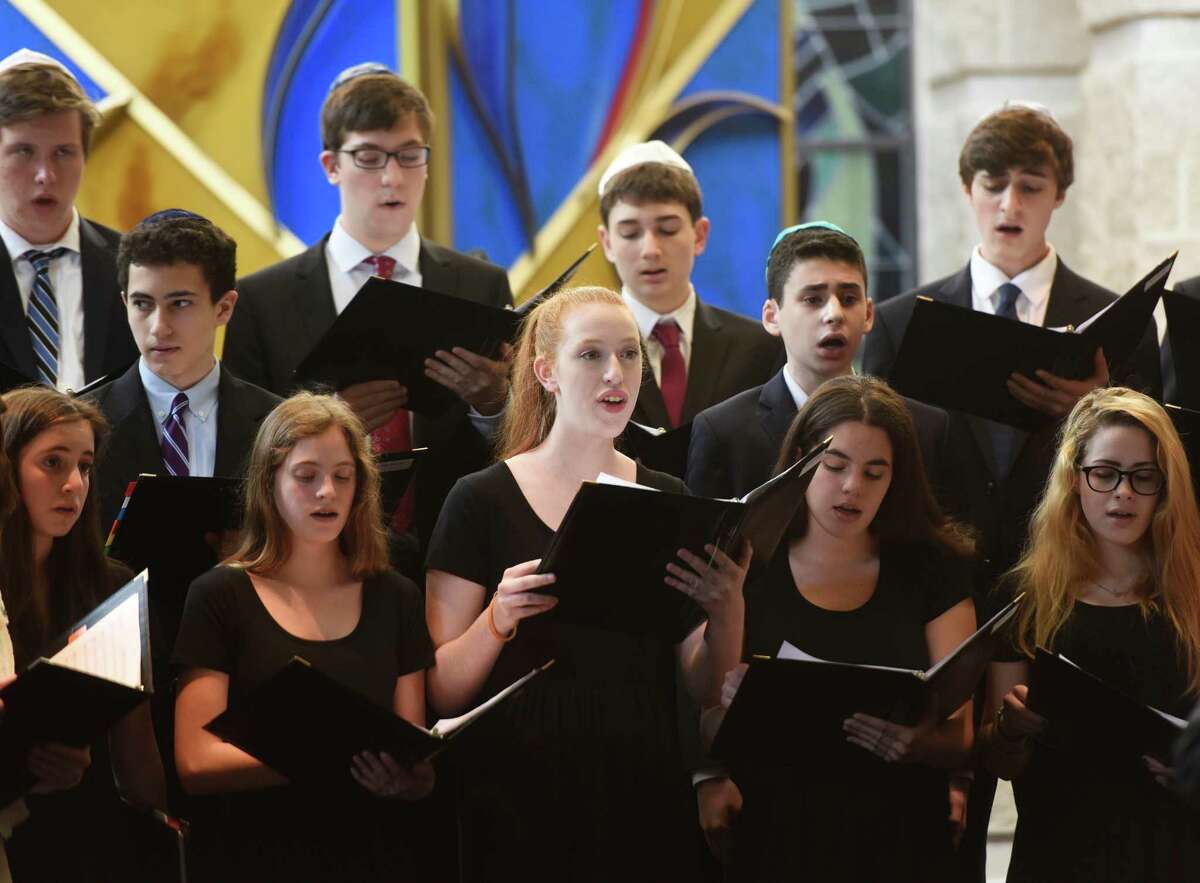 Hannah Bein, center, sings with other members of the teen choir during the Centennial Concert at Temple Sholom in Greenwich, Conn. Sunday, May 15, 2016. The concert explored the changes in Jewish music through time, spanning from early origins to contemporary and Jewish broadway and Yiddish theater. The performance featured vocals from several accomplished cantors and the Temple Sholom teen and youth choirs.