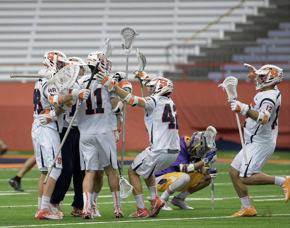 Syracuse players celebrate their win over UAlbany during the first round of Div. I Lacrosse NCAA playoffs, Sunday, May 15, 2016 in Syracuse, N.Y. (Jenn March/Special to the Times Union)