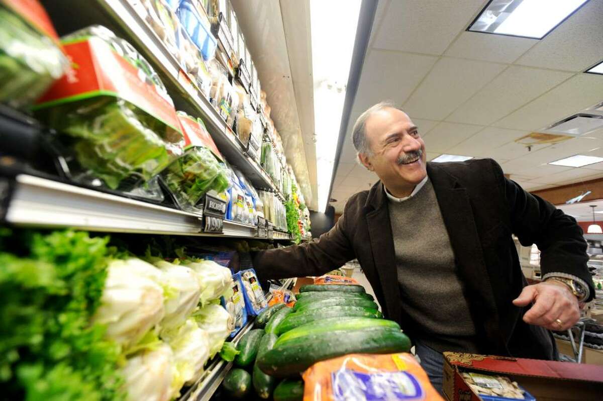 Jerry Porricelli works on the produce layout in the Porricelli's Market in Old Greenwich Saturday morning, Feb. 27, 2010. The store has been the family's flagship since 1950.