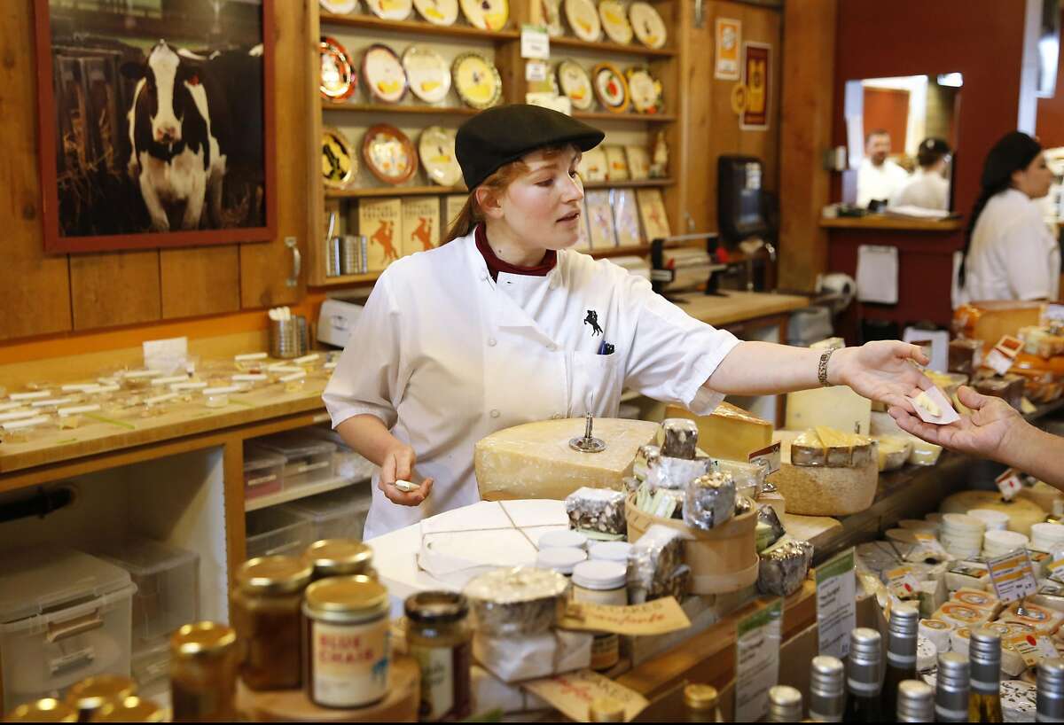 Christy Caye, Assistant Manager and Head of Cheese, gives a sample to a customer in Cowgirl Creamery May 14, 2016 in Point Reyes Station, Calif.