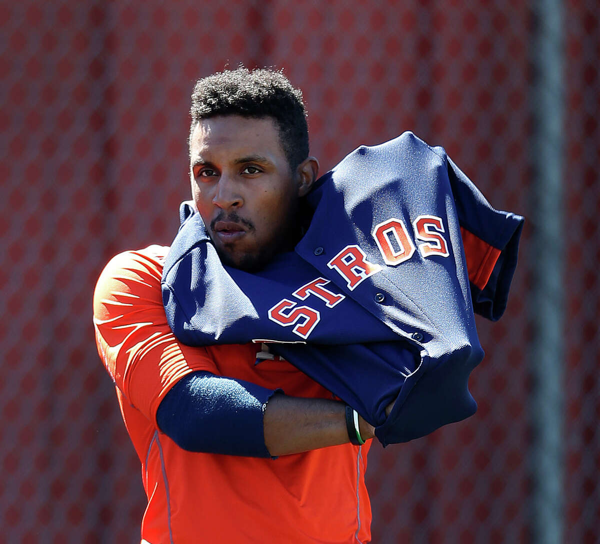 Houston Astros infielder Tony Kemp puts on his jersey at the Astros spring training in Kissimmee, Florida, Friday, Feb. 26, 2016.( Karen Warren / Houston Chronicle )