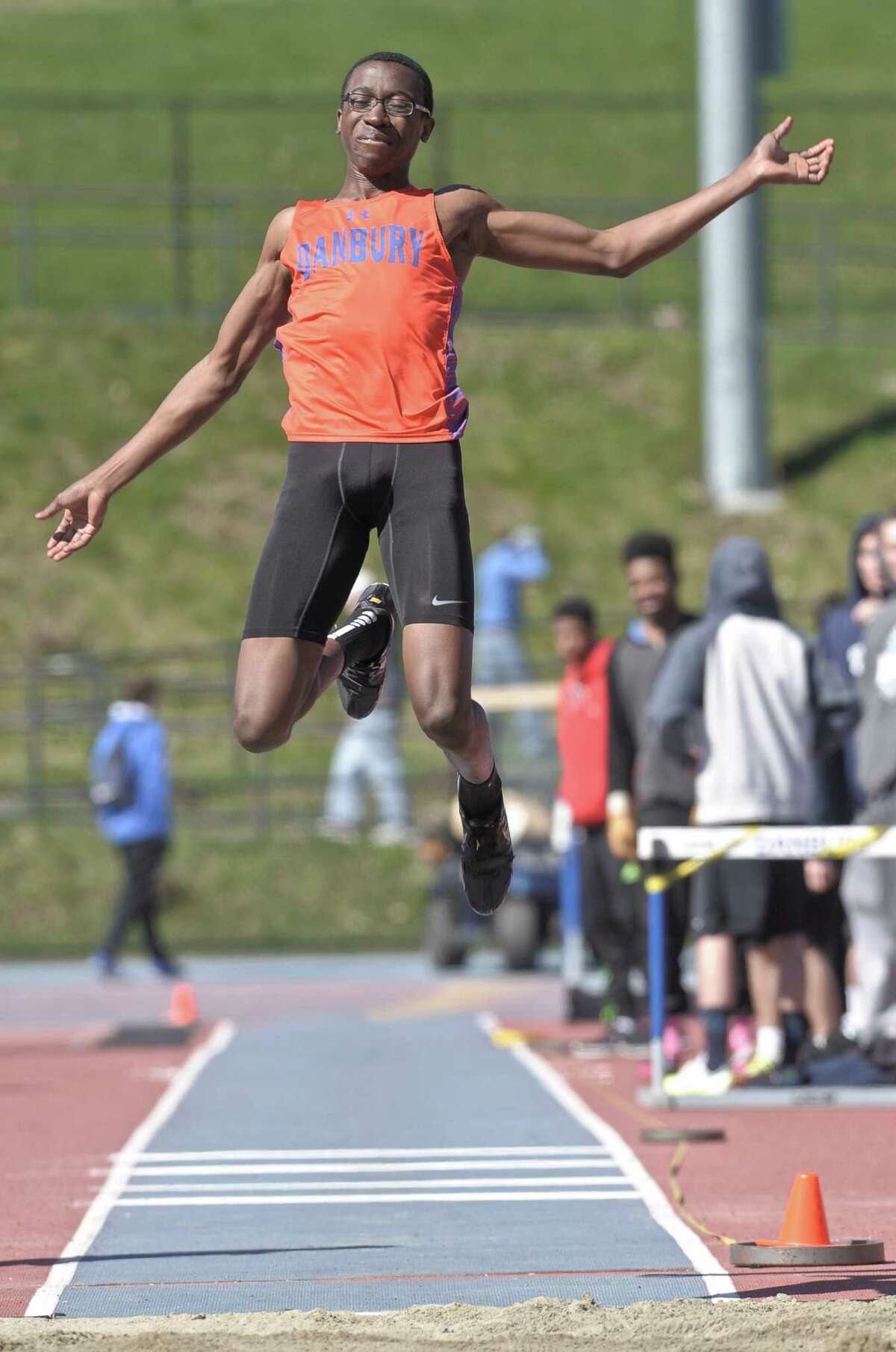 FILE PHOTO: Tumani Edwards, from Danbury High School, competes in the boys long jump during the high school track and field O'Grady Relays, held at Danbury High School, on Saturday, April 25, 2015, in Danbury, Conn.