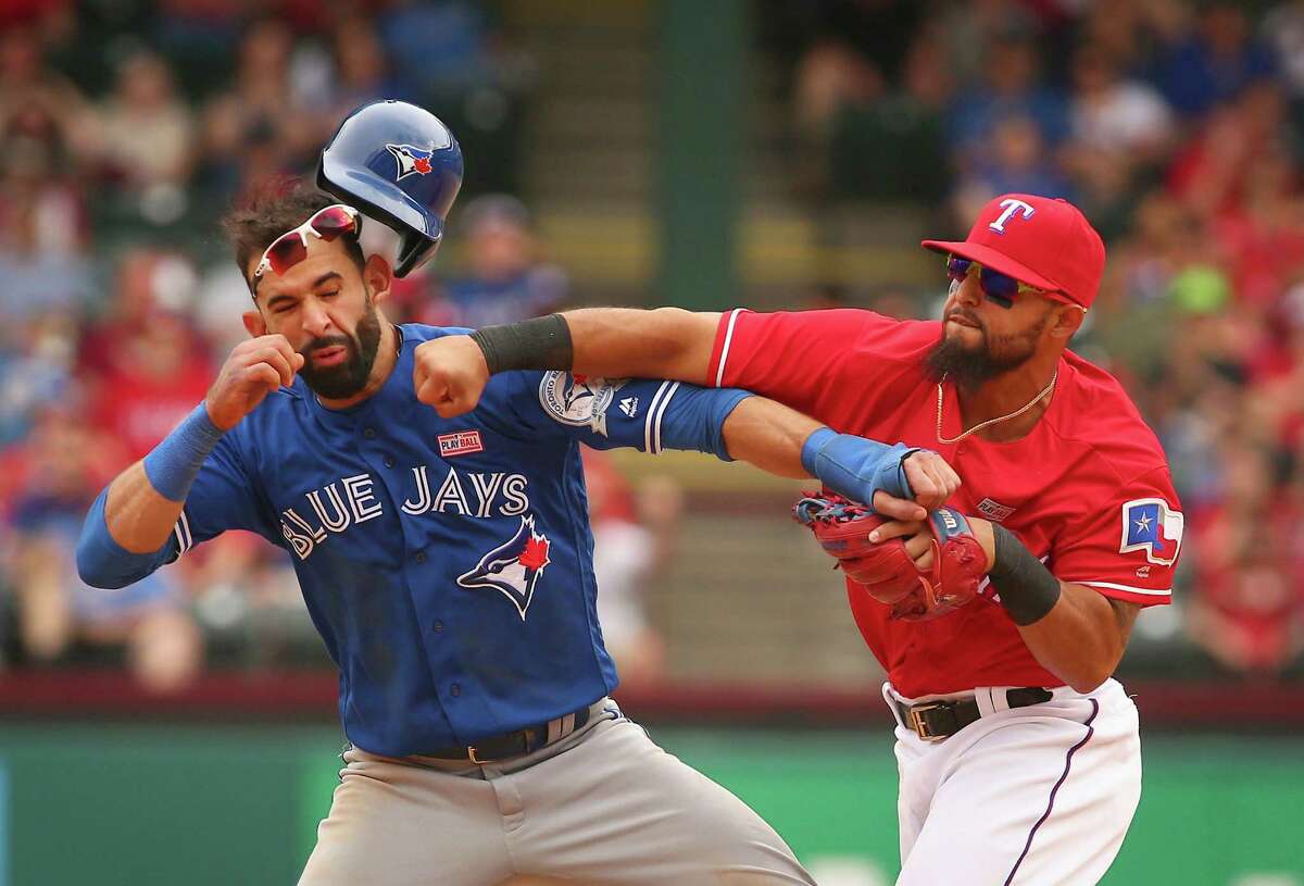 Texas Rangers Rougned Odor slugs Toronto Blue Jays Jose Bautista for sliding into him at second as Odor was trying to make a double play.