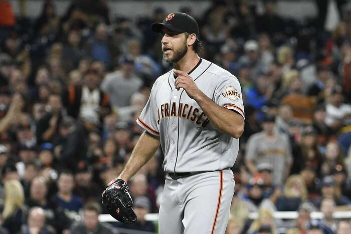 Giants manager Bruce Bochy returns to the locker room after the News  Photo - Getty Images