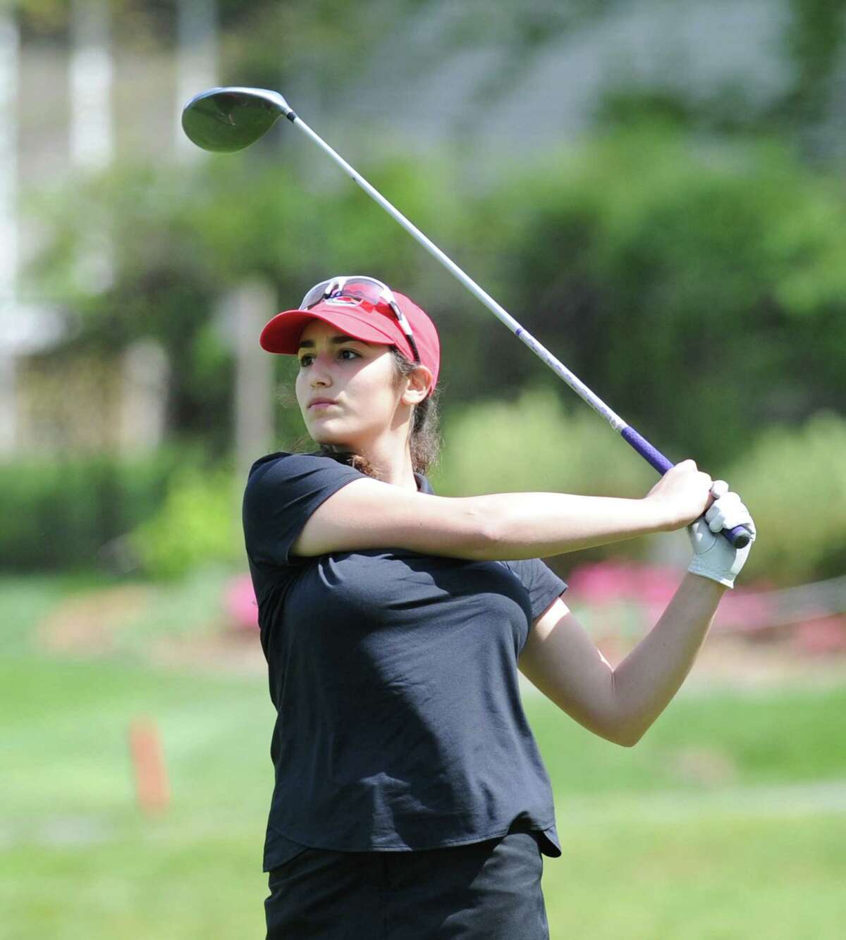 Tessa Piontkowski of New Canaan drives off the first tee during the girls high school golf match between Greenwich High School and New Canaan High School at the Milbrook Club in Greenwich, Conn., Thursday, May 12, 2016.
