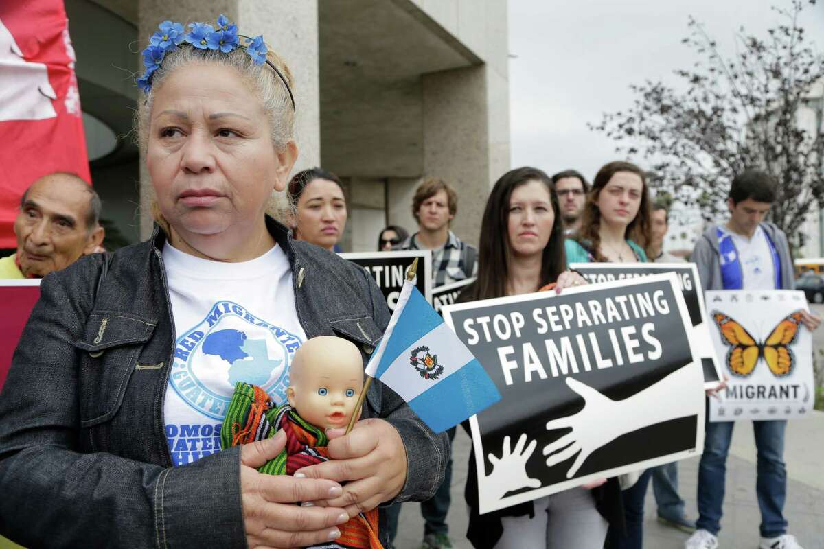Guatemalan immigrant Amariliz Ortiz holds a doll as she joins families impacted by the immigration raids during a rally with Members of the Coalition for Humane Immigrant Rights of Los Angeles, CHIRLA, outside the ICE Metropolitan Detention Center downtown Los Angeles, Tuesday, May 17, 2016. Families rally to call on the Obama Administration to grant Temporary Protected Status, TPS, to Central American women and children seeking refuge in the U.S. (AP Photo/Nick Ut)