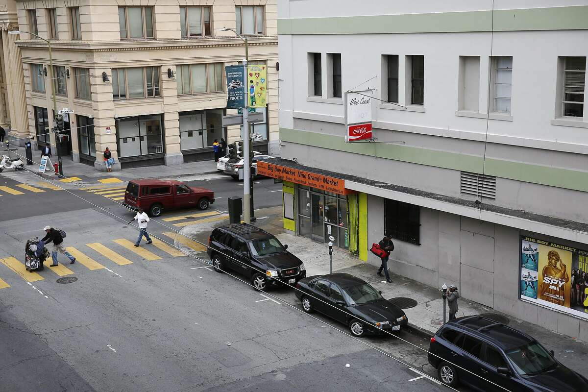 Pedestrians walk near the corner of Golden Gate and Leavenworth May 7, 2015 outside of the building 826 Valencia has signed a lease to take over in the Tenderloin in San Francisco, Calif.