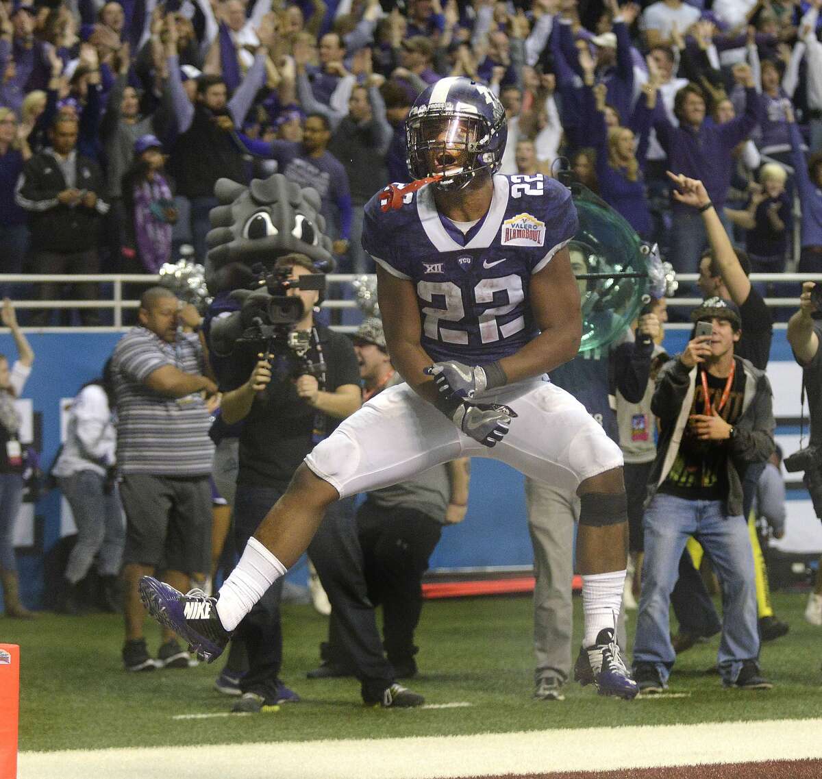 TCU running back Aaron Green celebrates after scoring a touchdown with just over three minutes to go in the fourth quarter at the Valero Alamo Bowl Saturday, Jan. 2, 2015. >>> Click through for a look at the San Antonio AAF roster so far >>>
