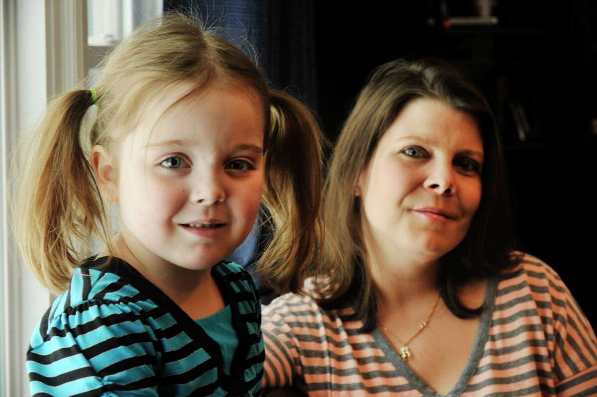 Ella Wright and her mother, Dana Haddox-Wright, are preparing for Oct. 1, when children will be able to medical marijuana in Connecticut. Ella has Dravet syndrome, a form of childhood epilepsy that some say is eased by cannabis oil.